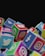 A collection of colorful cubes stacked together, each with the logo of a popular social media platform such as Twitter, Instagram, Facebook, and WhatsApp. The cubes are arranged in a way that they appear to be tumbling or piled up.