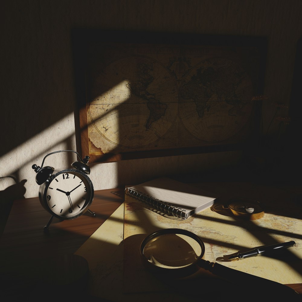 a desk with a clock and a magnifying glass