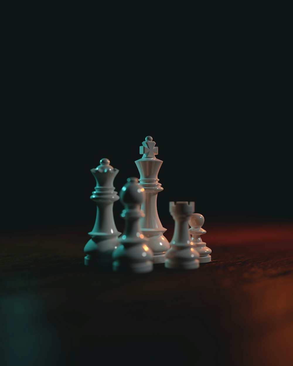 a group of white chess pieces sitting on top of a table