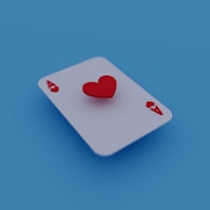 An Ace of Hearts playing card is placed on a blue background, with a three-dimensional red heart symbol hovering above the card.