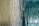 A close-up of a textured surface with flowing vertical lines resembling wood grain patterns, featuring a blend of earthy beige and deep teal colors.