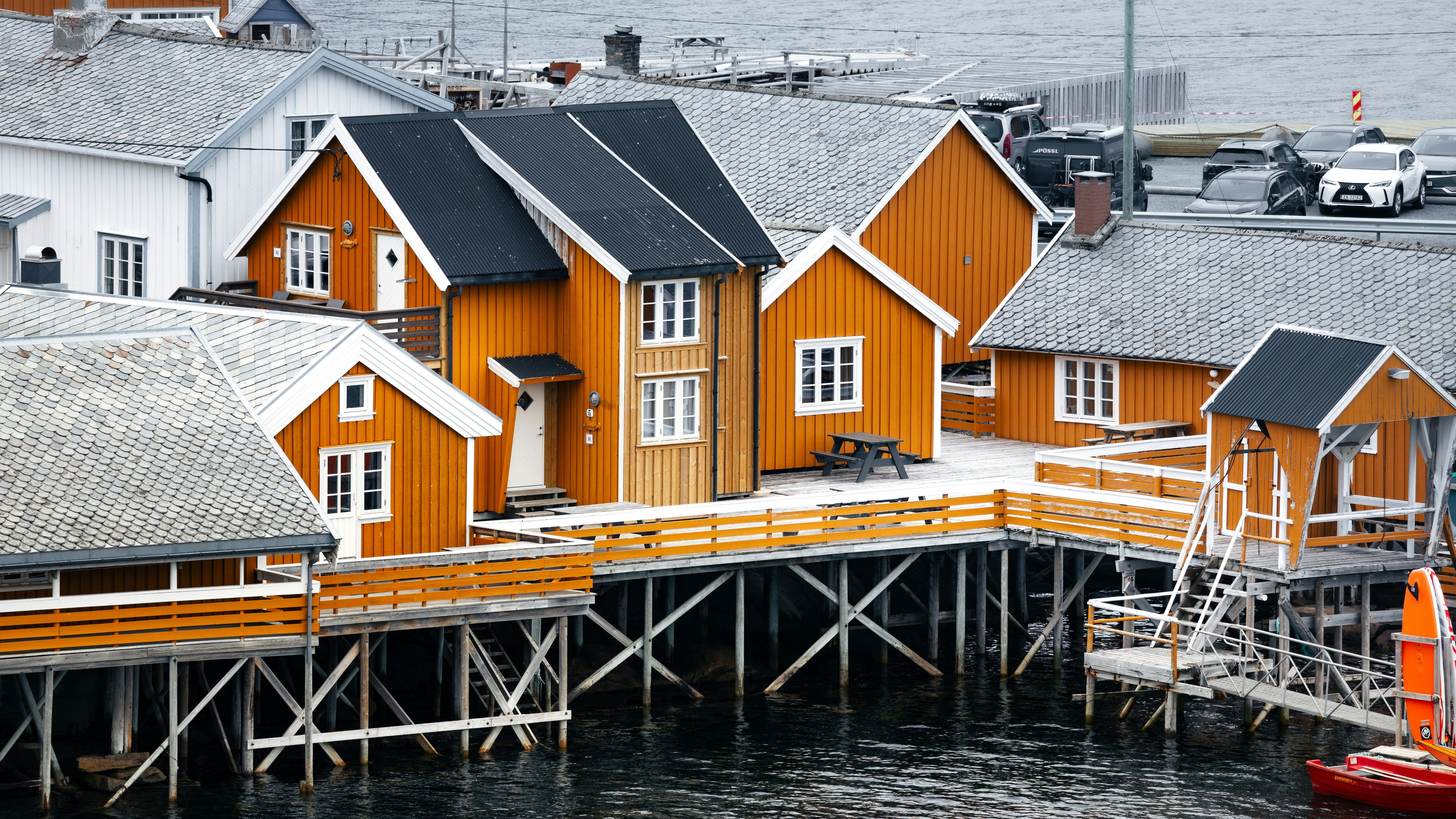 a group of houses sitting on top of a pier