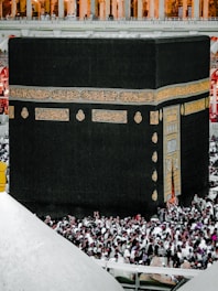 A serene view of the Kaaba surrounded by pilgrims in prayer.