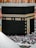 A serene view of the Kaaba surrounded by pilgrims in prayer.