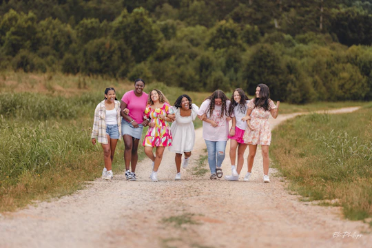 A group of church members walking outdoors, smiling and supporting each other.