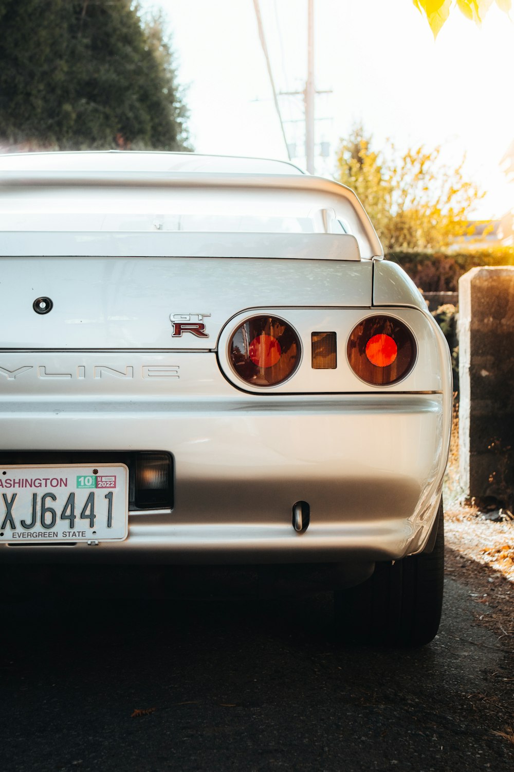 a white car parked on the side of the road