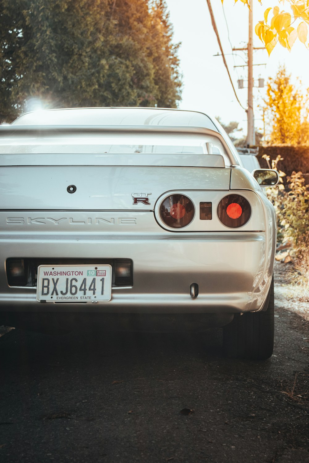 a silver car parked on the side of the road