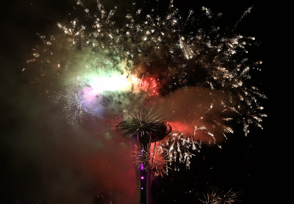 fireworks are lit up in the night sky