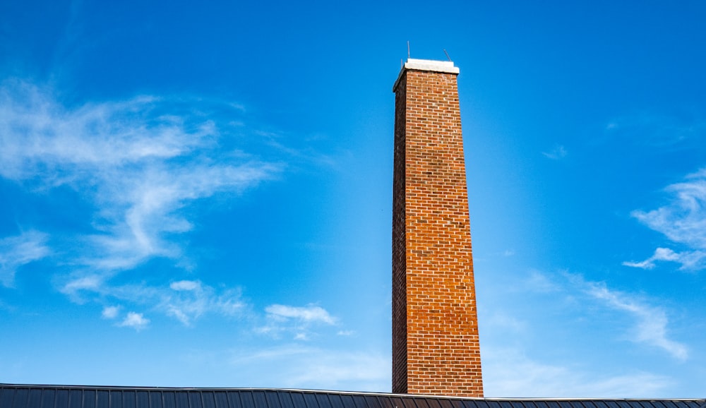 a tall brick tower with a sky background