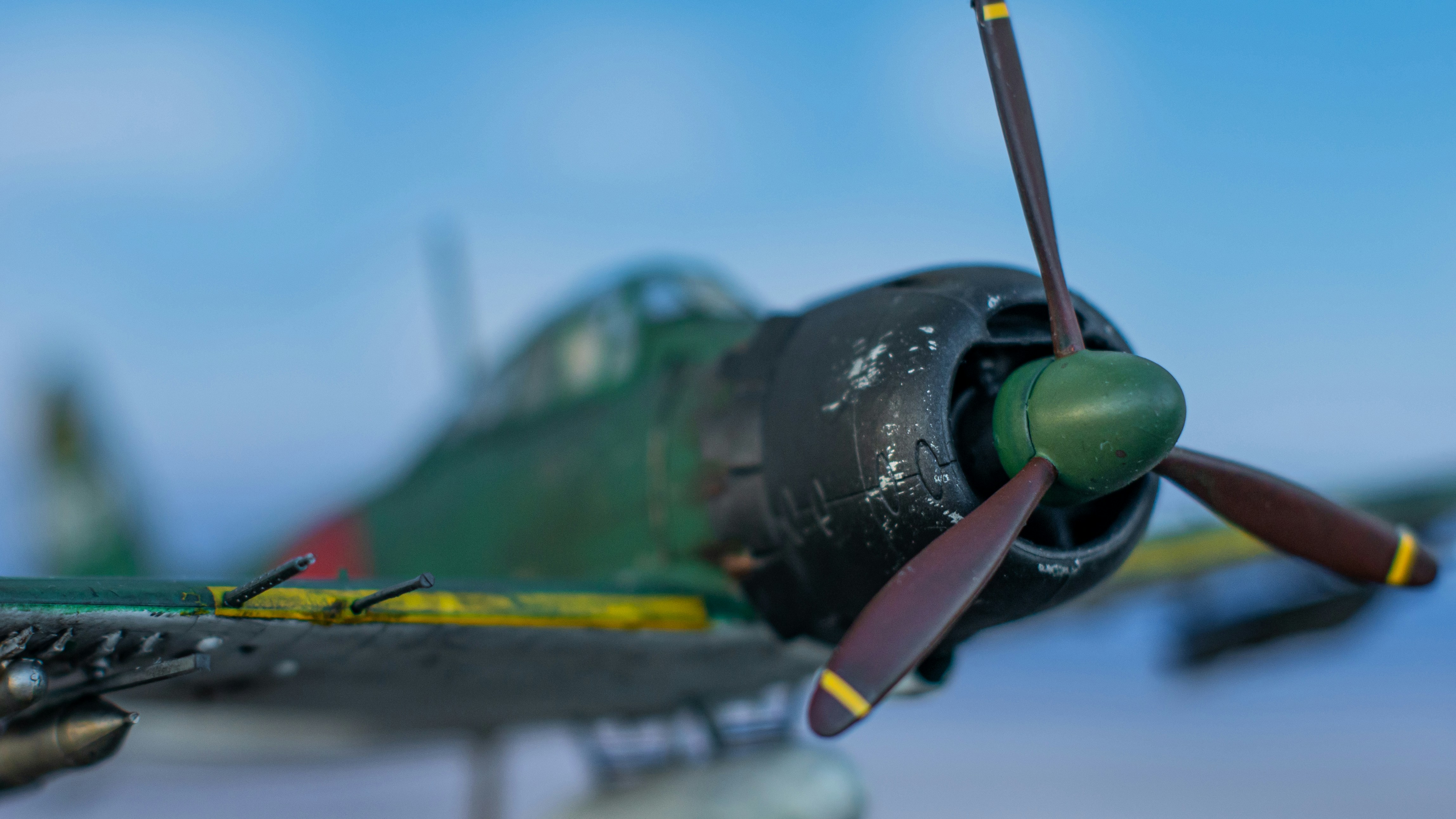a green and yellow airplane is flying in the sky, My model of the Japanese A6M "Zero" fighter in 1:48
