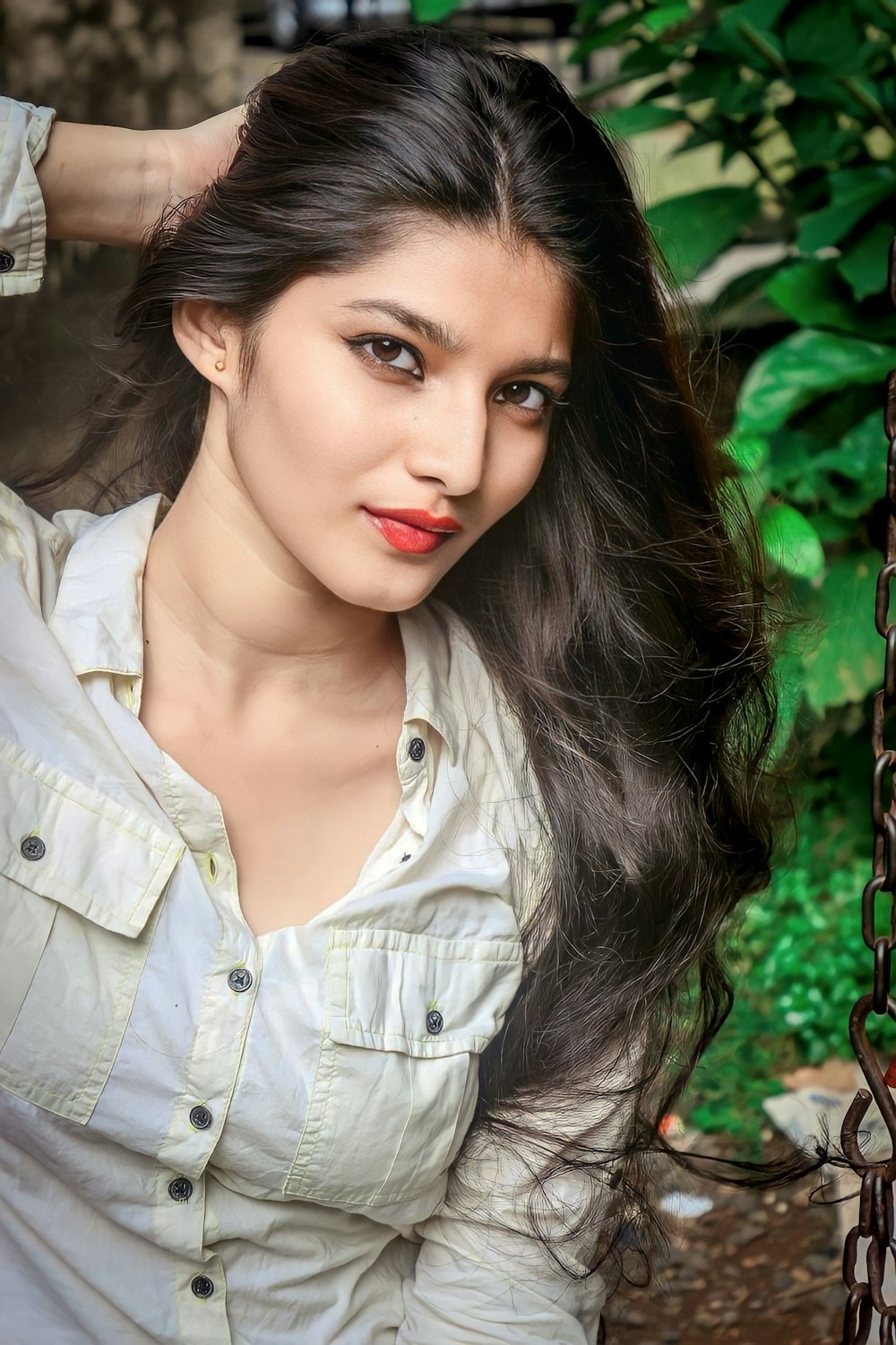 a woman with long hair posing for a picture