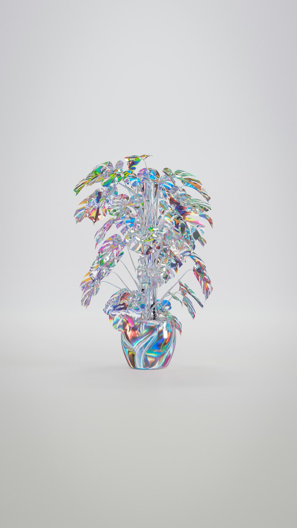 a glass sculpture of a tree with colorful leaves