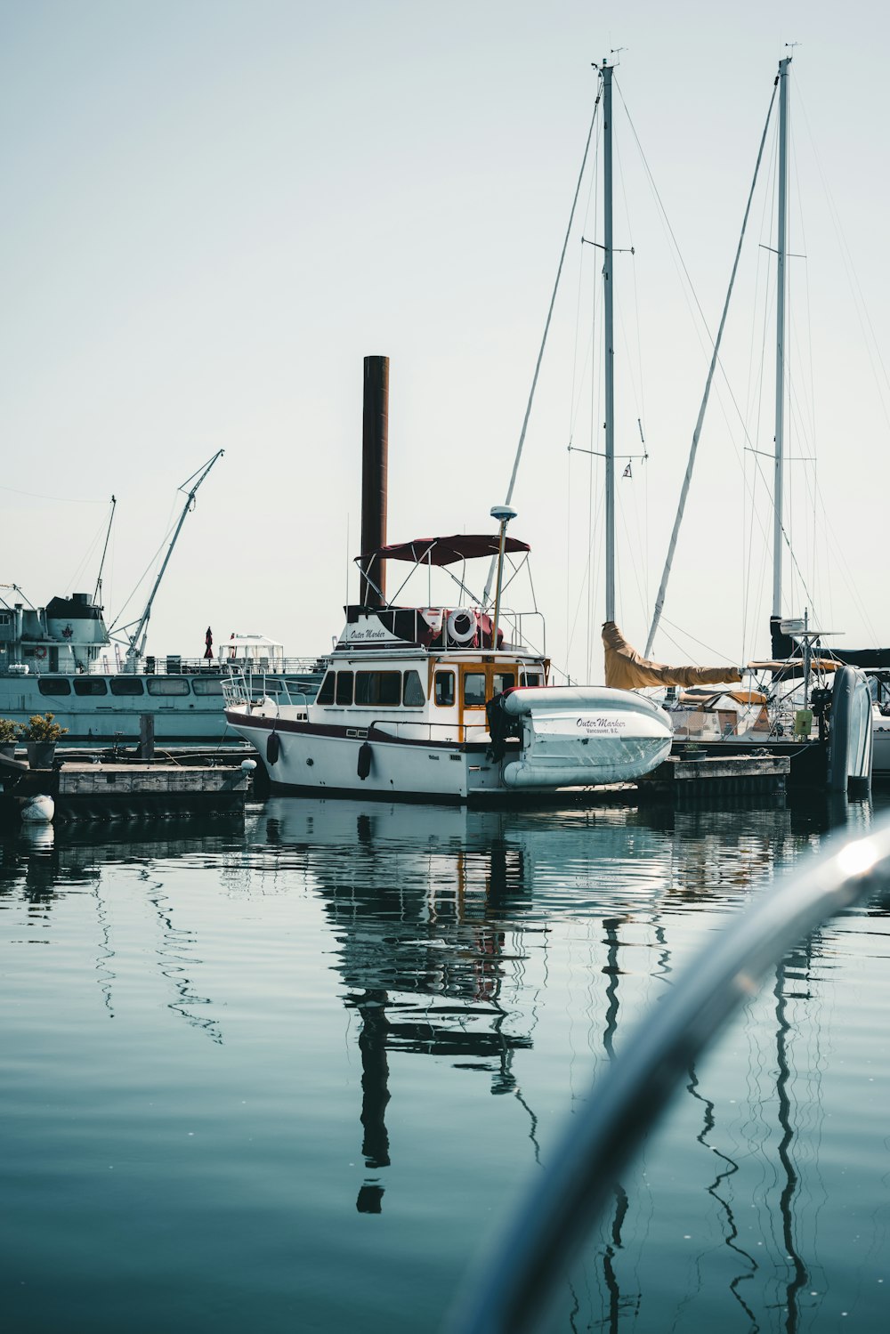 a boat docked at a dock with other boats