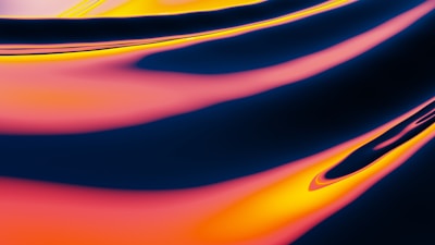 A vibrant and abstract composition of flowing, smooth lines and gradients. The image features an interplay of rich pink, yellow, and blue hues, creating a dynamic and fluid visual effect. The color transitions are seamless, offering a sense of movement and energy reminiscent of liquid or fabric in motion.