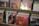Several rows of music CDs arranged in a display shelf, with pink price stickers on some of them.