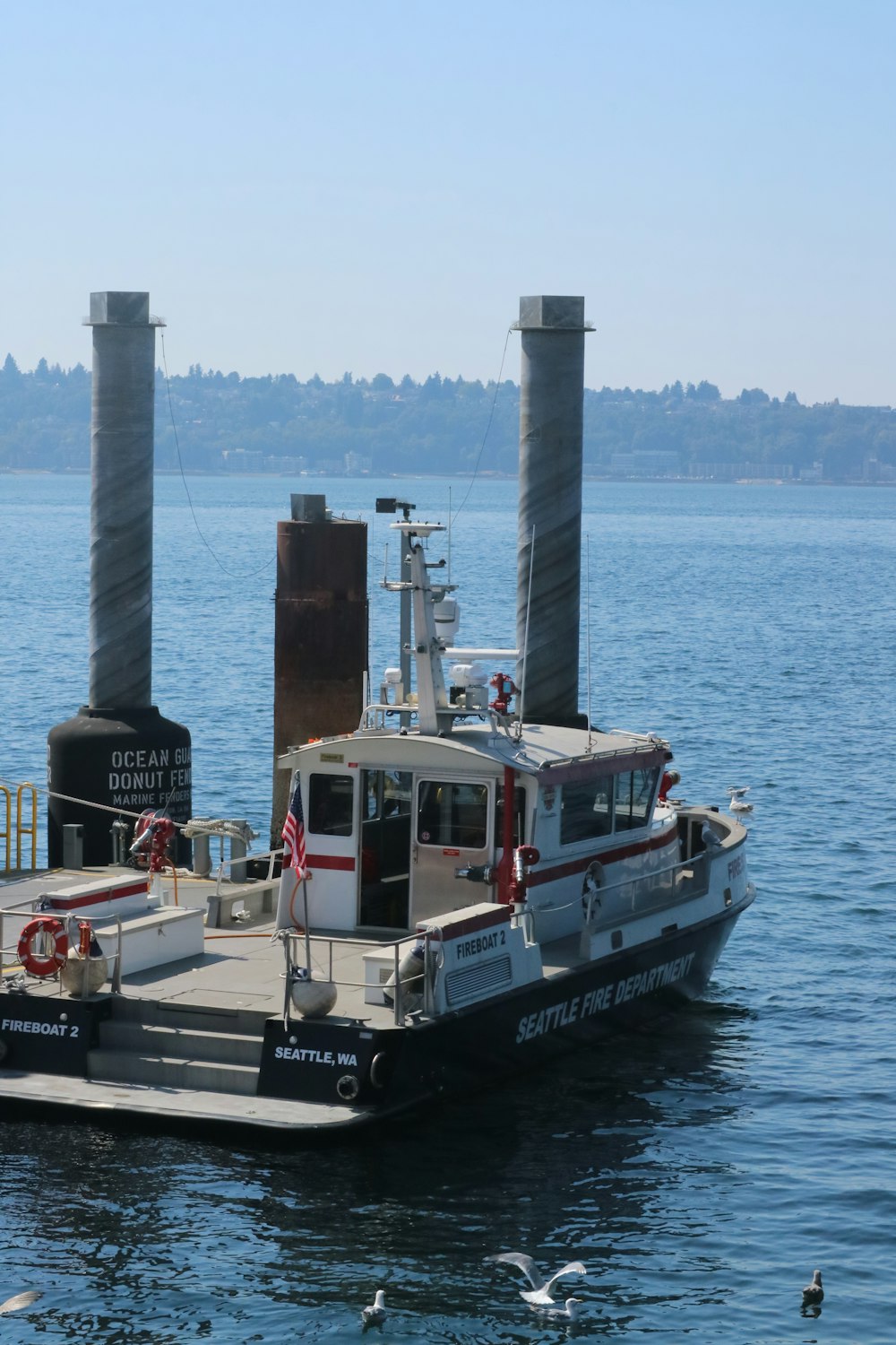 a boat is docked at a pier in the water