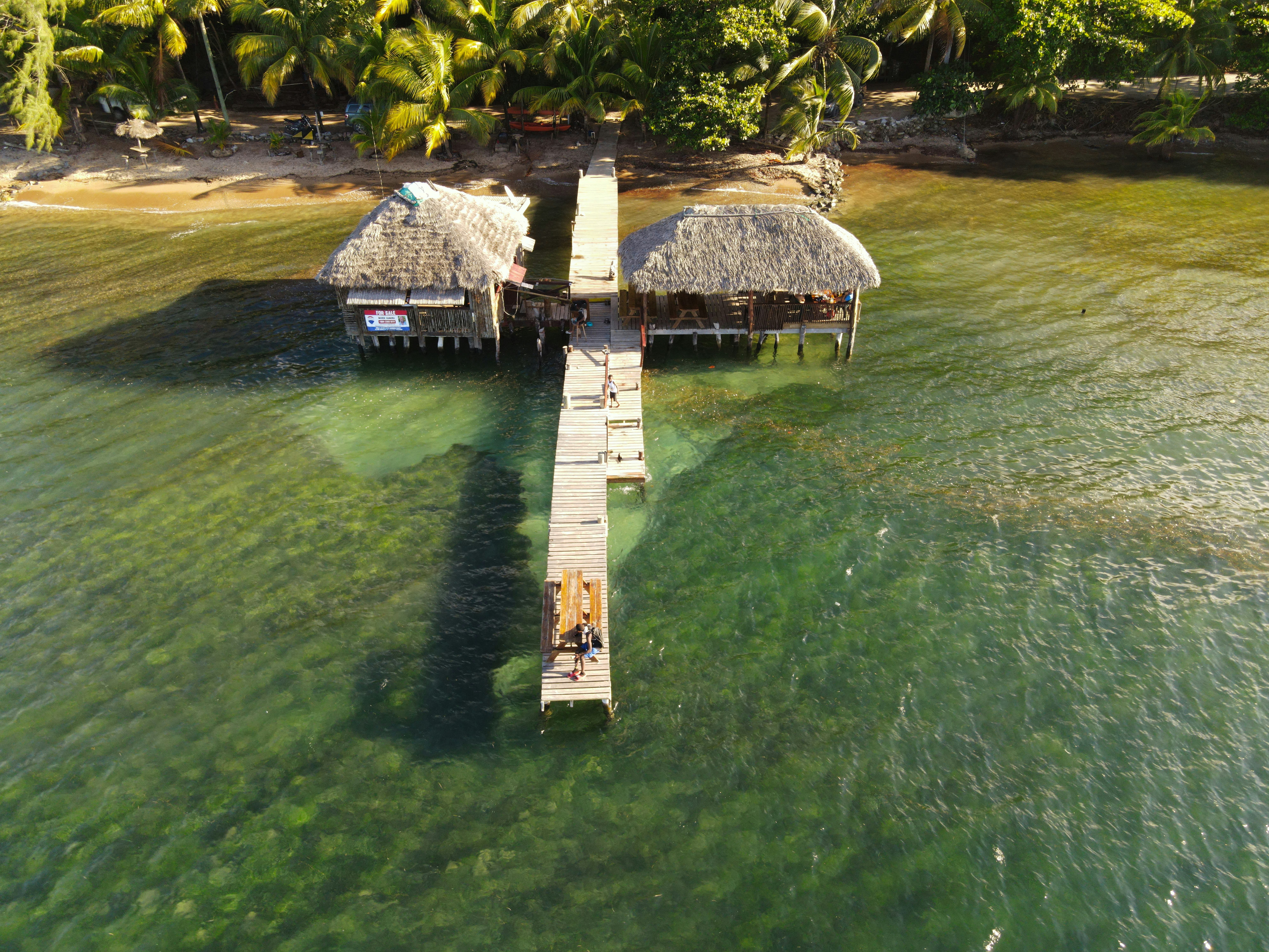 a couple of huts sitting on top of a pier