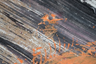 Abstract video art with vibrant orange highlights on black