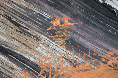 Abstract video art with vibrant orange highlights on black