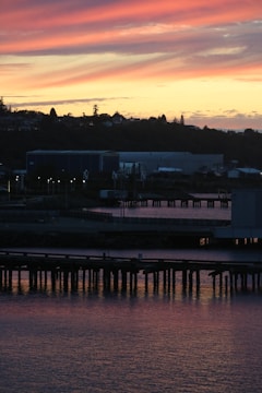 A beautiful sunset over a waterfront property.
