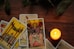 a candle sitting next to a set of tarot cards