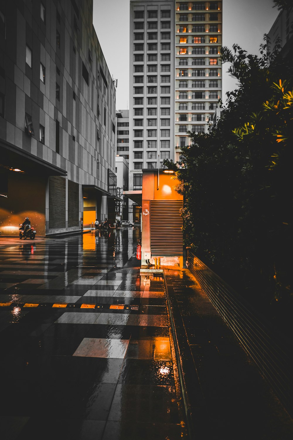 a black and white photo of a city street at night