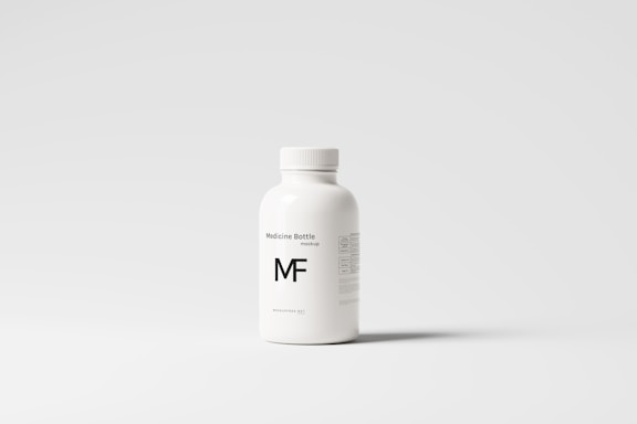 A white plastic bottle with a screw top, labeled 'Medicine Bottle mockup' and the letters 'MF' in bold. The bottle is placed against a plain, light gray background, with some small text details visible on the right side.