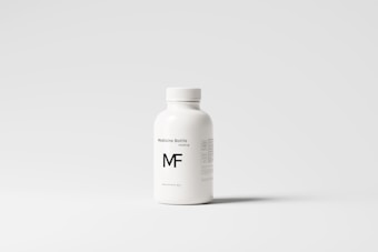 A white plastic bottle with a screw top, labeled 'Medicine Bottle mockup' and the letters 'MF' in bold. The bottle is placed against a plain, light gray background, with some small text details visible on the right side.