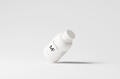 A simplistic and modern design featuring a medicine bottle floating against a light grey background, with minimalistic labeling and a clean appearance.