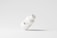 A simplistic and modern design featuring a medicine bottle floating against a light grey background, with minimalistic labeling and a clean appearance.