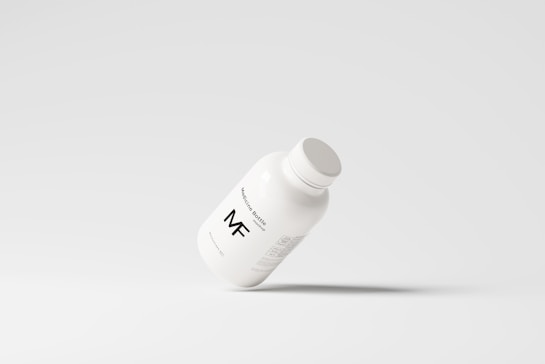 A simplistic and modern design featuring a medicine bottle floating against a light grey background, with minimalistic labeling and a clean appearance.