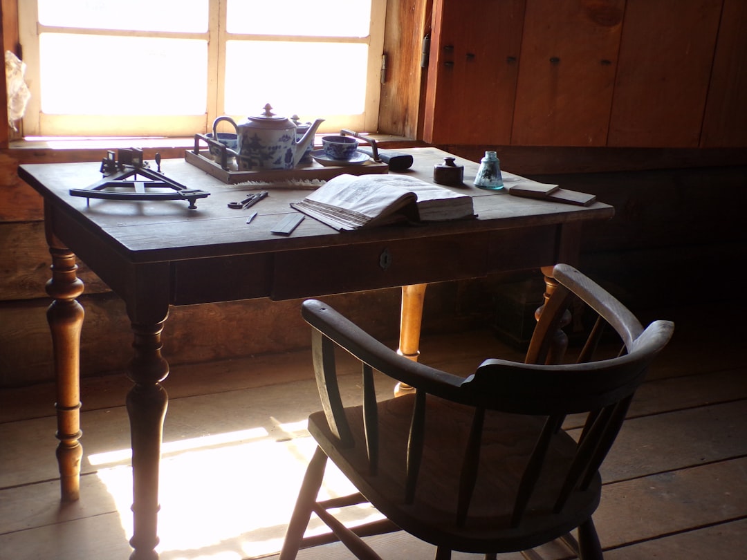 a wooden table with a tea pot on top of it,