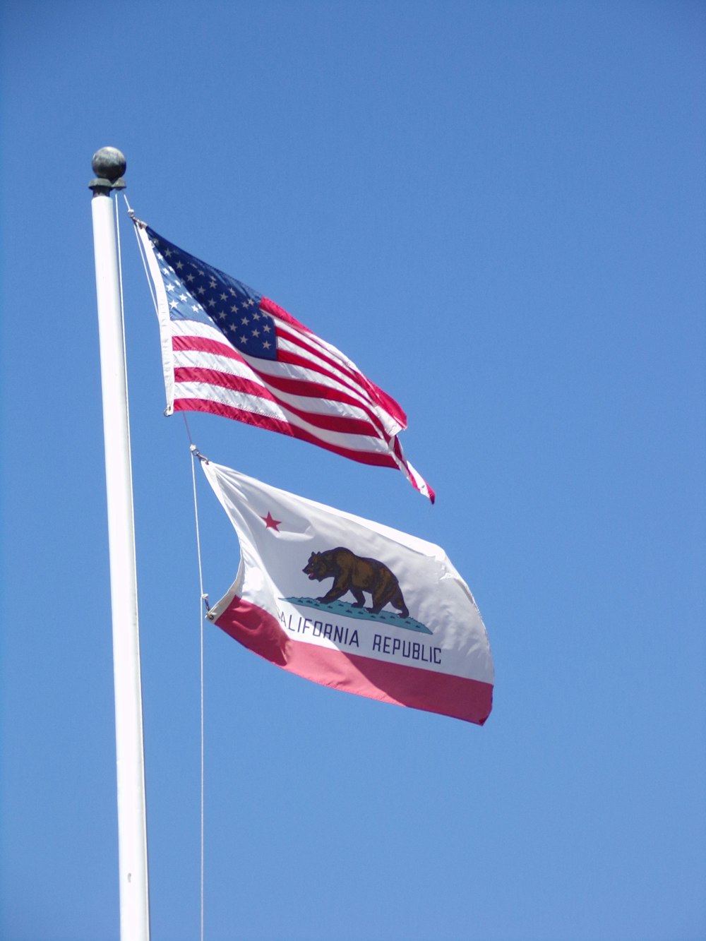 a couple of flags that are flying in the air