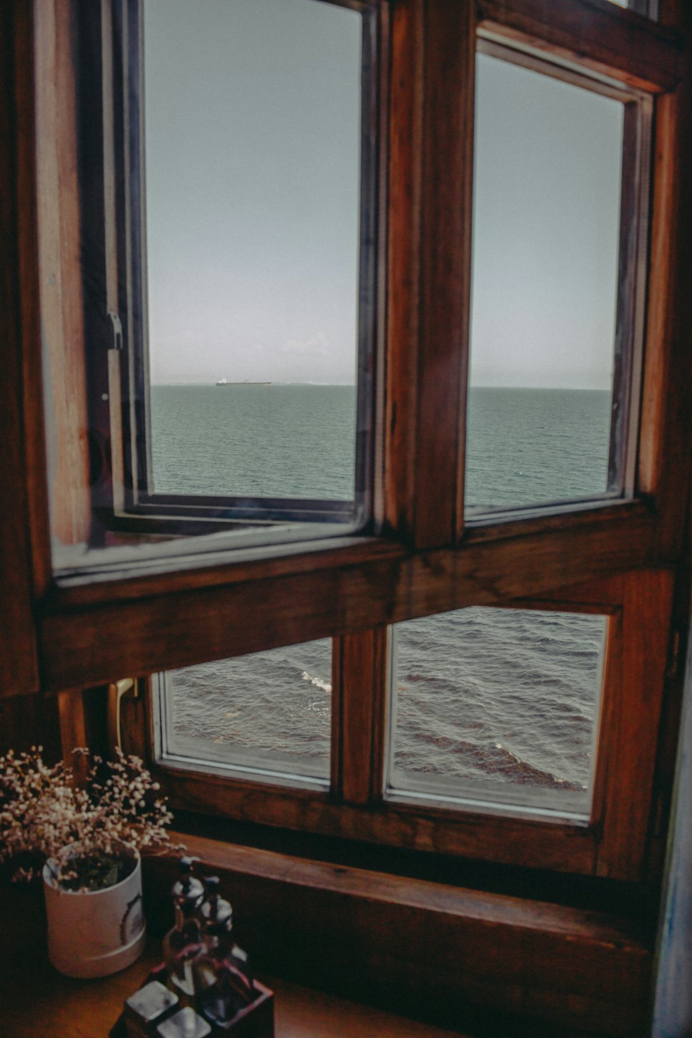 a window with a view of the ocean