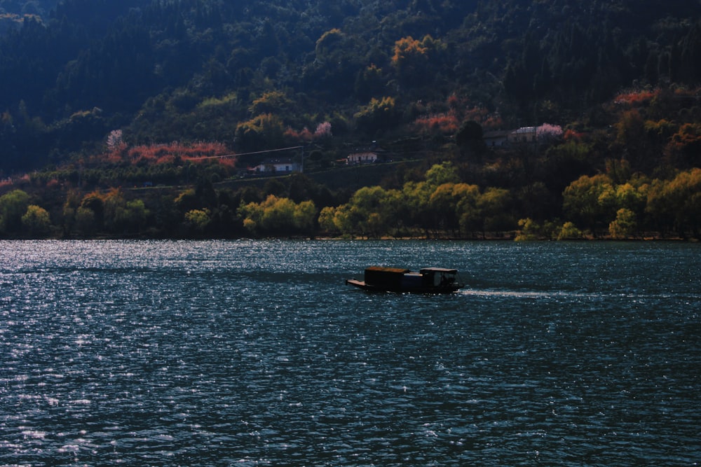 a couple of boats floating on top of a lake