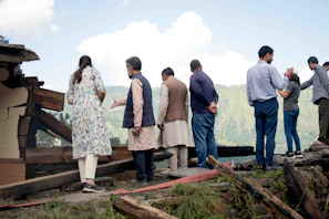 Team members inspecting structural damage and planning next restoration steps.