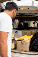 A driver receiving cargo details on a mobile device inside a truck cabin