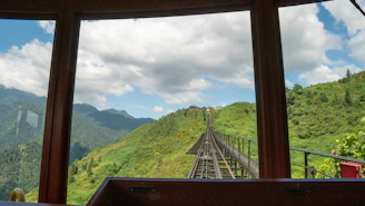 A scenic view through a Unicorn UPVC window framing the majestic Himalayan peaks.
