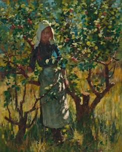A person stands amidst a lush orchard, surrounded by green leaves and branches with small red fruits. The individual has a serene expression and is dressed in a dark outfit with a white headscarf and apron. The sunlight filters through the foliage, creating a dappled light effect on their face and clothing.