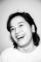 Smiling individual reviewing their personalized brain wellness profile report.