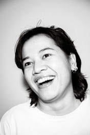 A portrait photograph showcasing a smiling individual.