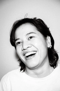 Portrait of a happy woman smiling confidently after successful immigration process.