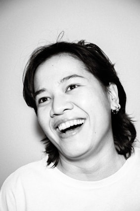A portrait of Marcelo Lemos smiling.