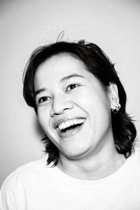 Portrait of a joyful participant sharing their experience after a coaching session