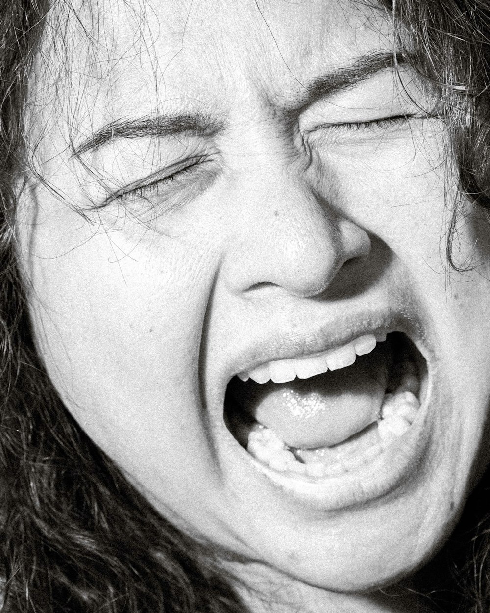 a close up of a person with their mouth open