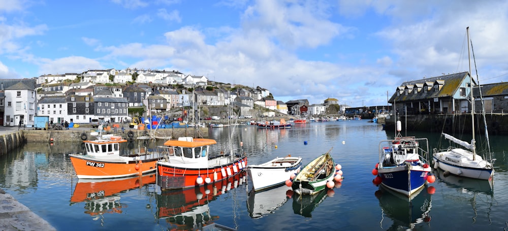 a group of boats floating on top of a body of water