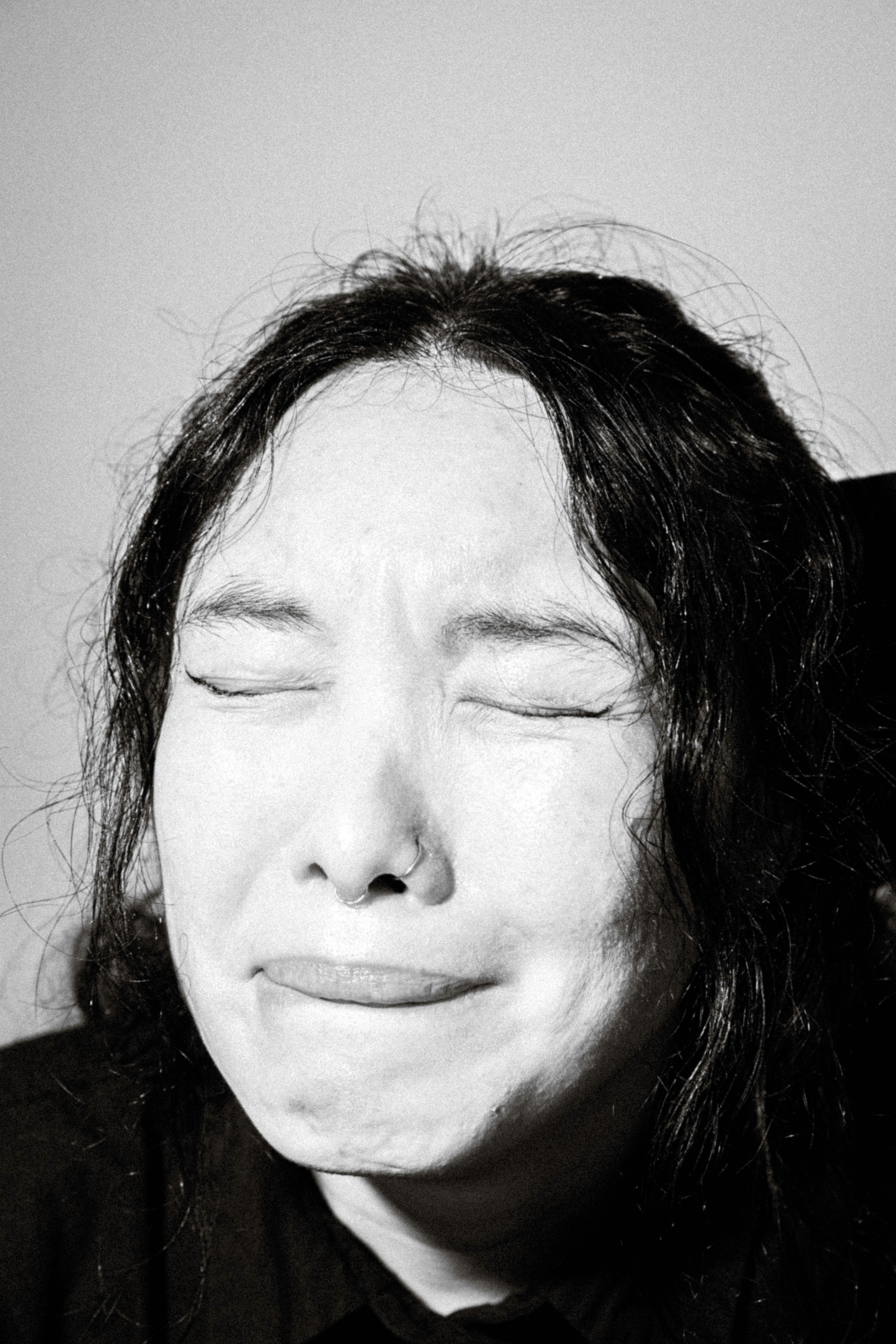 A black and white photo of a man with his eyes closed photo – Free ...