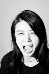 A black and white portrait showing deep emotion.