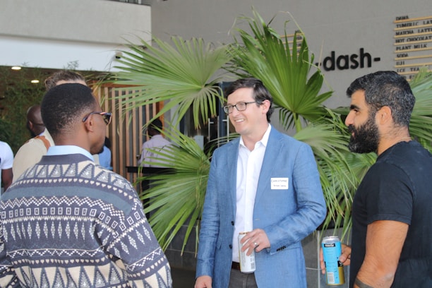Guests enjoying drinks and conversation in a stylish restaurant bar.