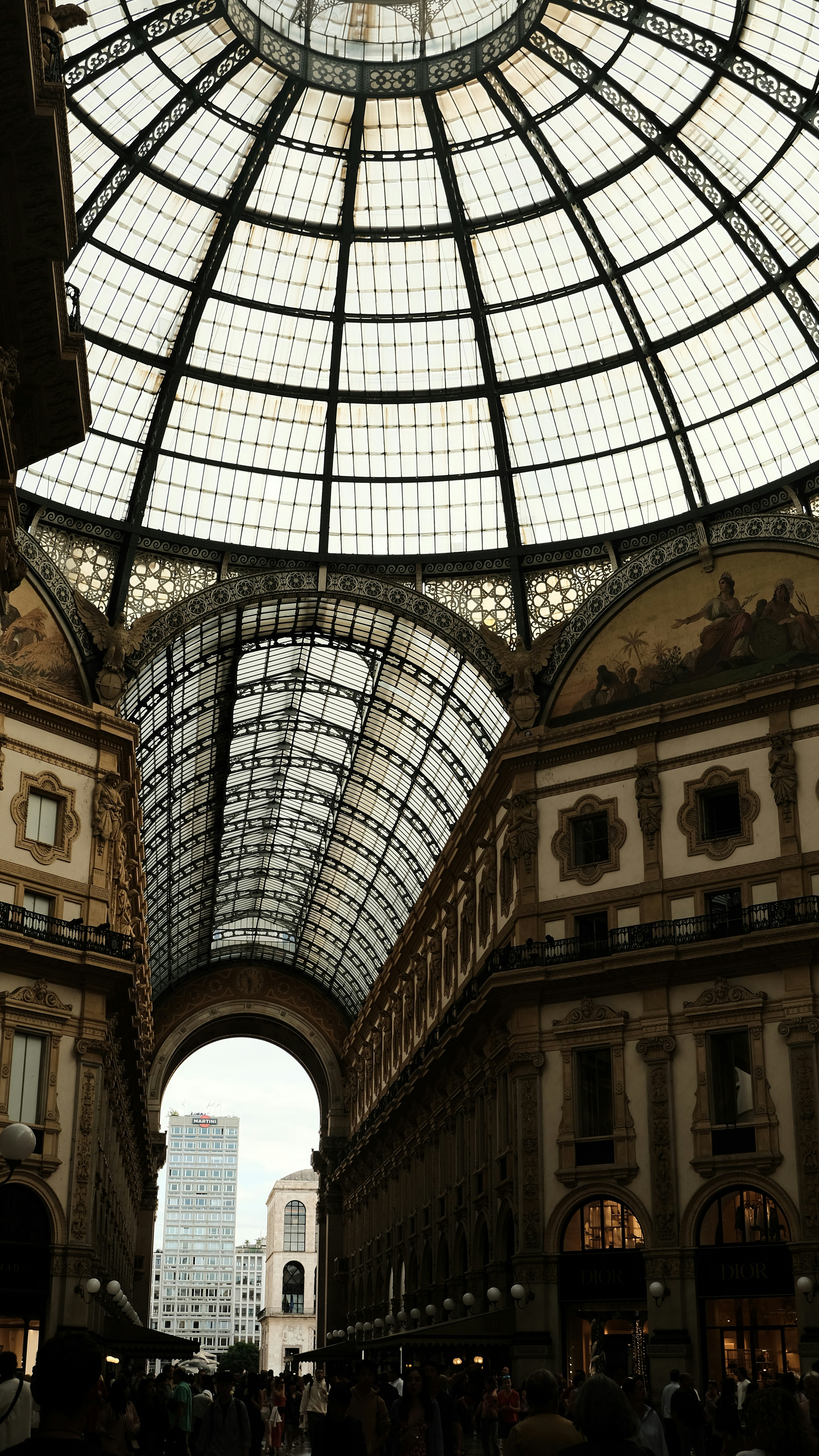 a large glass ceiling in a shopping mall